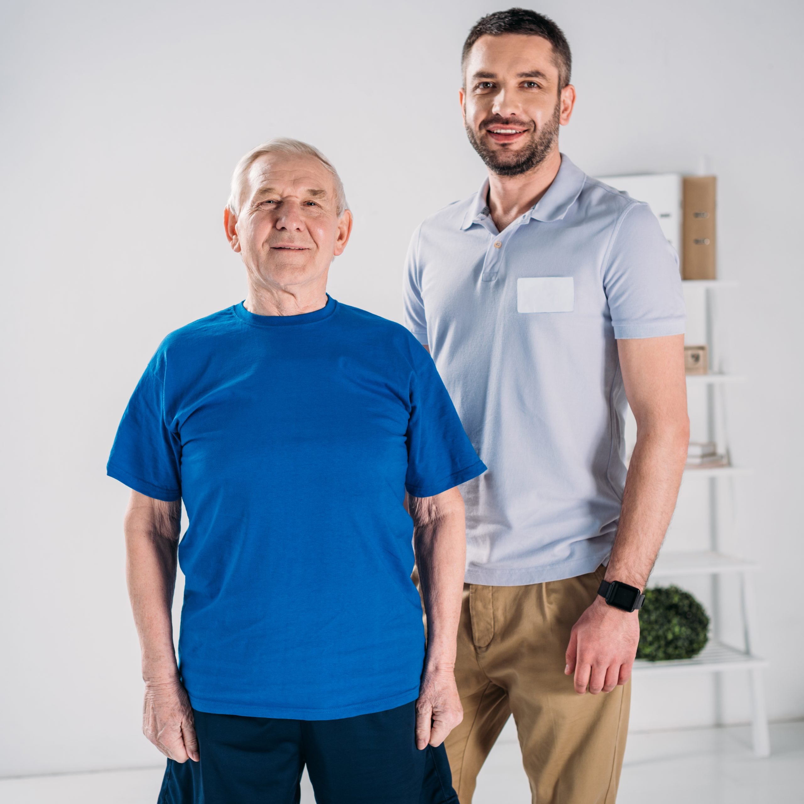 Home Care Gastonia NC male caretaker with male client standing smiling