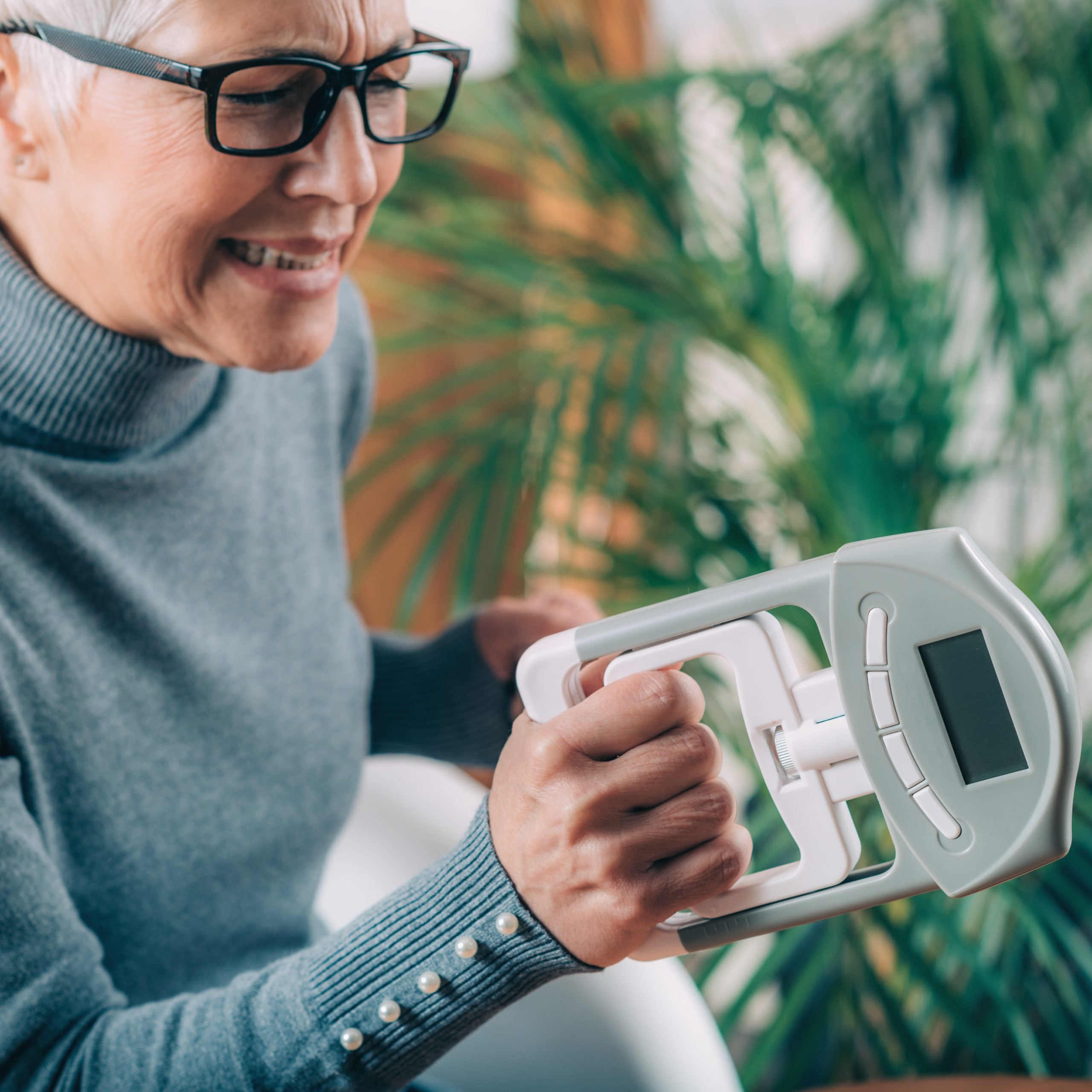 Home Care Indian Trail NC elder woman holding strange machine